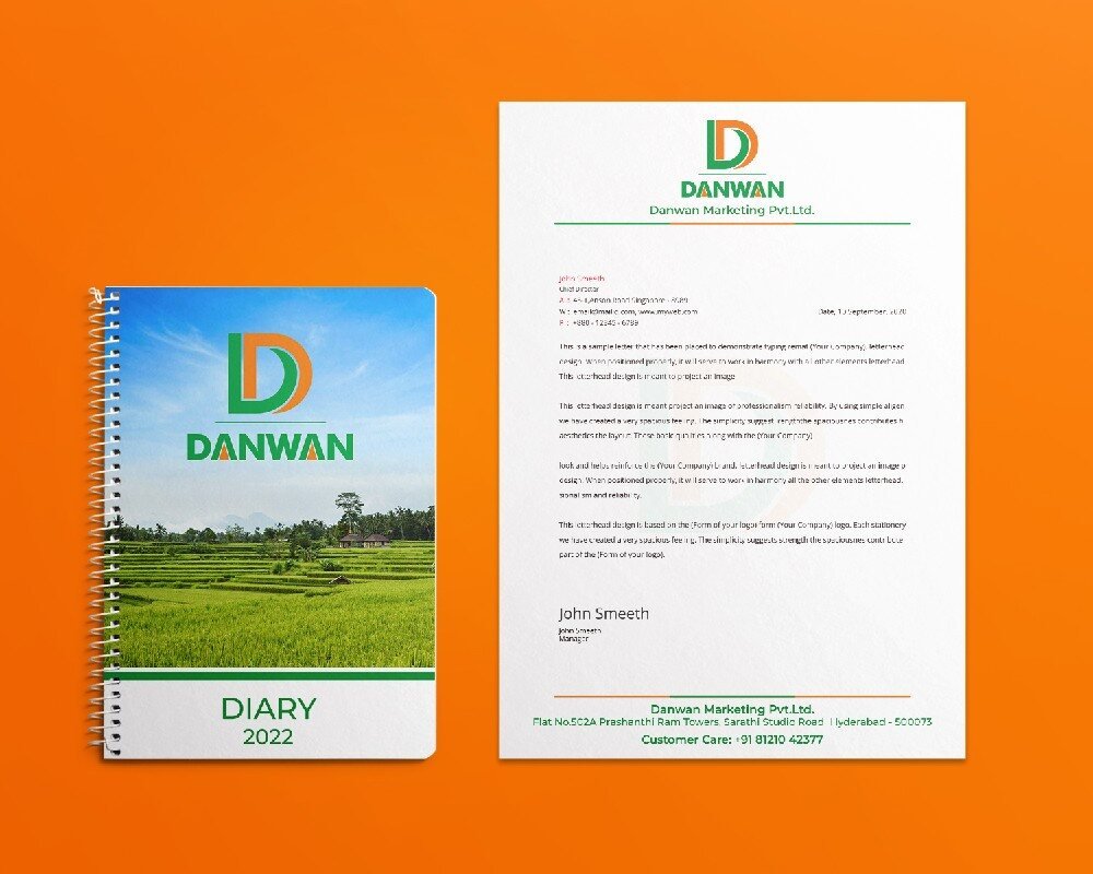 Danwan branded diary and letterhead stationery on orange