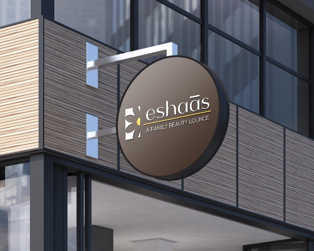 Round Eshaas hanging sign on a building facade