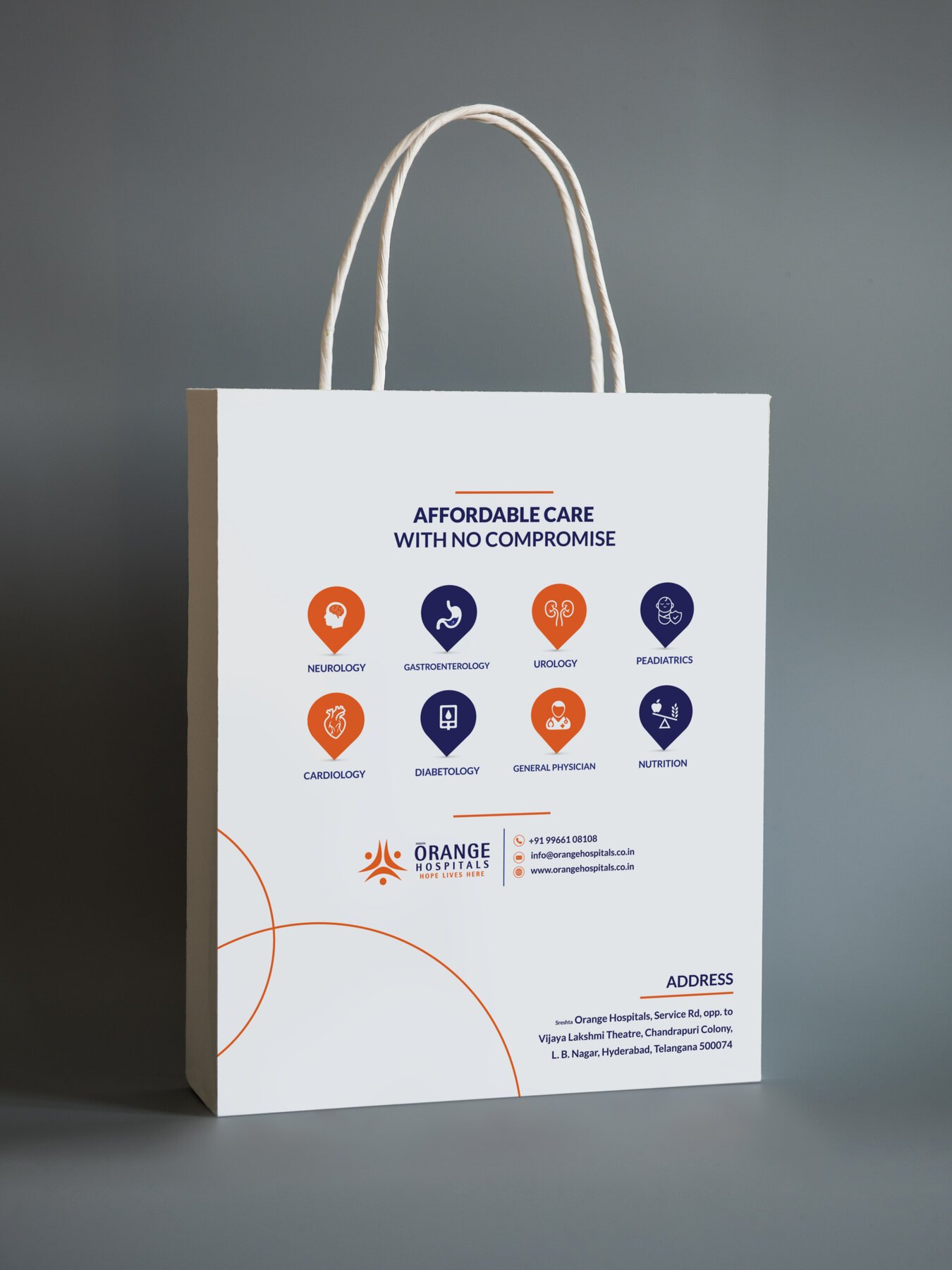Orange Hospitals CT scan report carry bag back with services and address