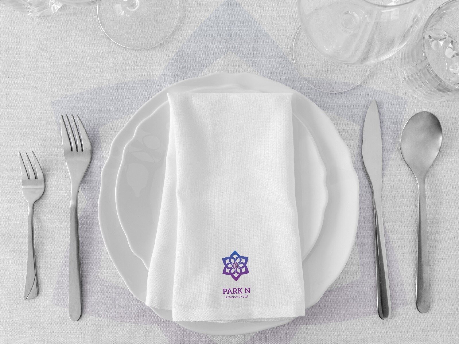 Park N hotel table setting with branded napkin